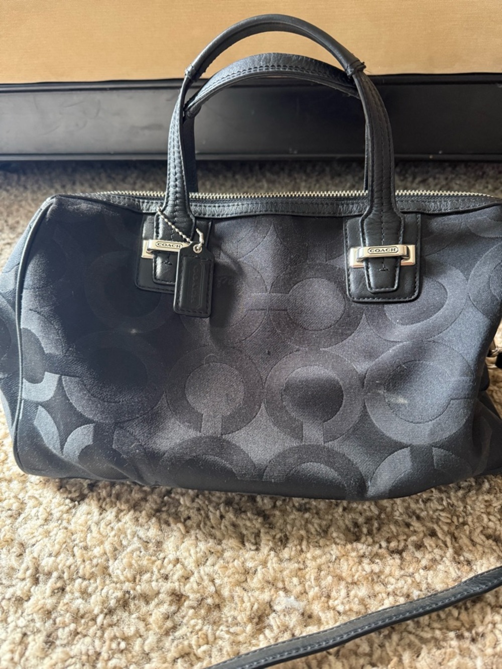 Coach Taylor Op Art Satchel in black signature fabric.